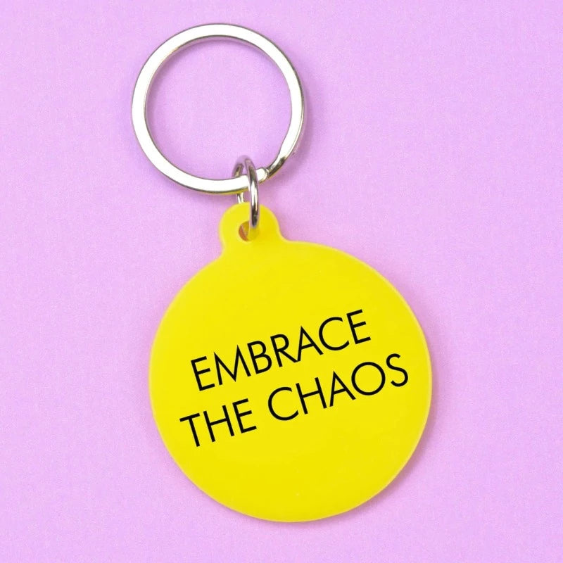 Schlüsselanhänger Embrace The Chaos – Flamingo-Kerzen